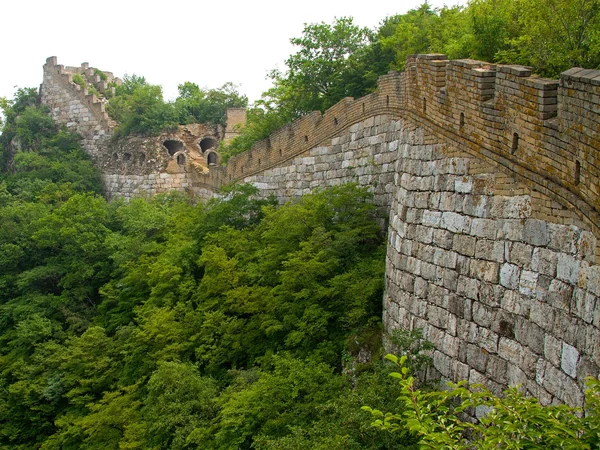 Unrestored Great Wall and watchtower in the Jiankou mountain landscape Unrestored Great Wall and watchtower in the Jiankou mountain landscape
