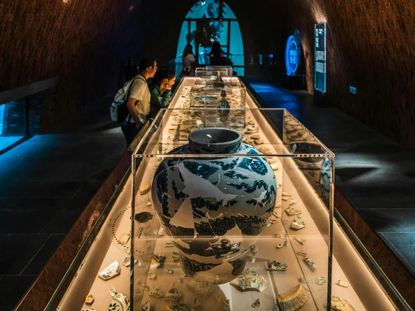 Ceramic vessels displayed on a long table in Jingdezhen, Jiangxi Ceramic vessels displayed on a long table in Jingdezhen, Jiangxi