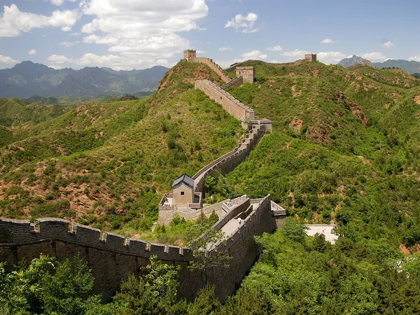 Wide panorama of Jinshanling Great Wall across mountain ridges