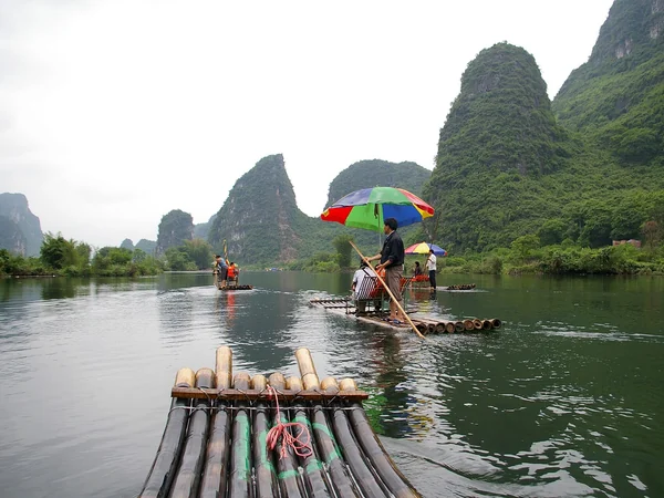 Boats beneath karst peaks on the Li River near Guilin Boats beneath karst peaks on the Li River near Guilin