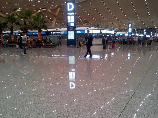 Travelers arriving at Kunming Changshui International Airport Travelers arriving at Kunming Changshui International Airport