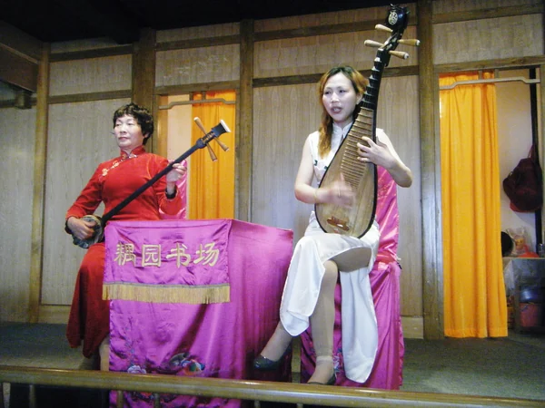 Kunqu opera actor in refined costume during a Suzhou performance