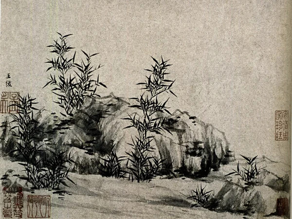 Artist demonstrating Chinese ink painting with a brush