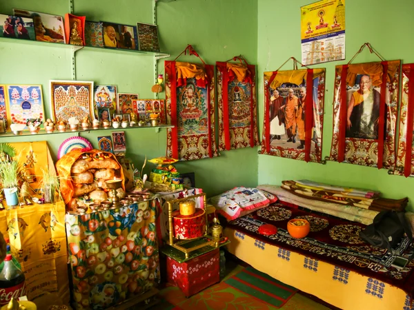 Tibetan home prayer room in Bylakuppe, India, where khapse pastries were shared during Losar Tibetan home prayer room in Bylakuppe, India, where khapse pastries were shared during Losar