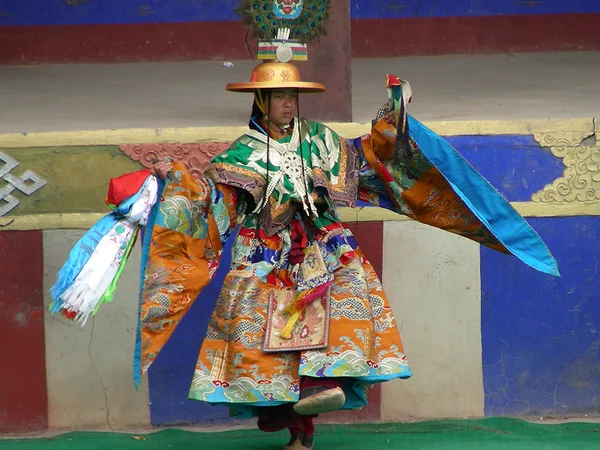 Monk performing a ceremonial dance during Losar at Domthok Monastery near Gyegu in Kham Monk performing a ceremonial dance during Losar at Domthok Monastery near Gyegu in Kham