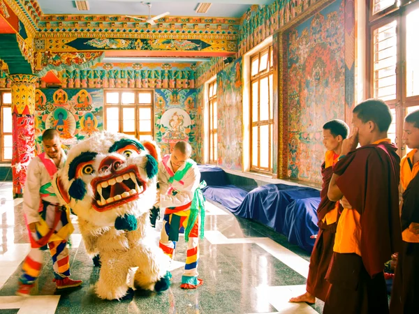 Tibetan Buddhist monks preparing for a Losar cultural gathering at Namdroling Monastery in India