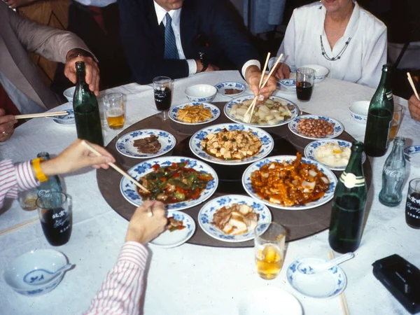 Shared dishes placed on the rotating center of a Chinese dining table Shared dishes placed on the rotating center of a Chinese dining table