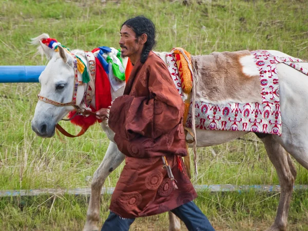 Tibetan men in formal regional clothing Tibetan men in formal regional clothing