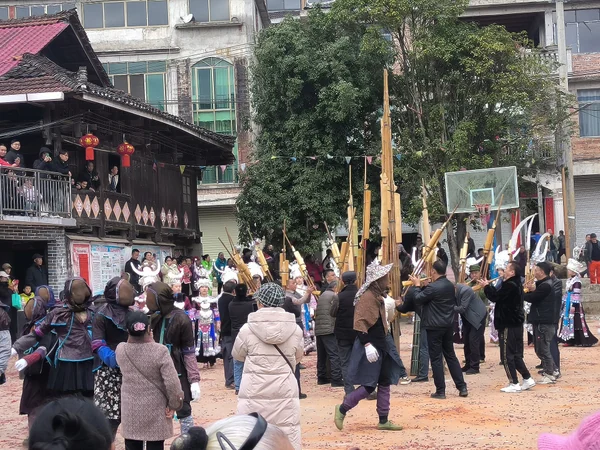 Miao performers playing lusheng and dancing at a cultural gathering in Guangxi Miao performers playing lusheng and dancing at a cultural gathering in Guangxi