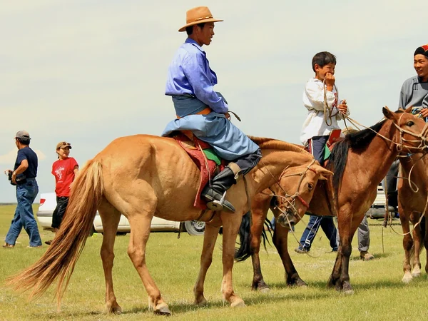 Horse riders taking part in a Naadam festival event in Mongolia Horse riders taking part in a Naadam festival event in Mongolia
