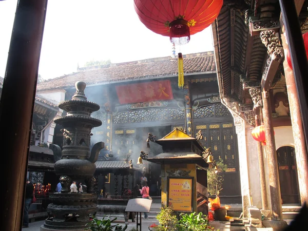 A Buddhist temple surrounded by a dramatic Chinese mountain landscape