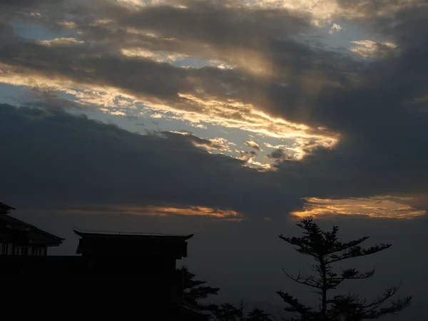 Clouds and temple architecture at Mount Emei’s Golden Summit Clouds and temple architecture at Mount Emei’s Golden Summit