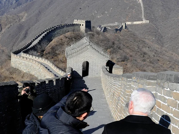 International visitors walking at Mutianyu Great Wall in winter