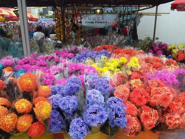 Shoppers preparing for Chinese New Year at a flower market