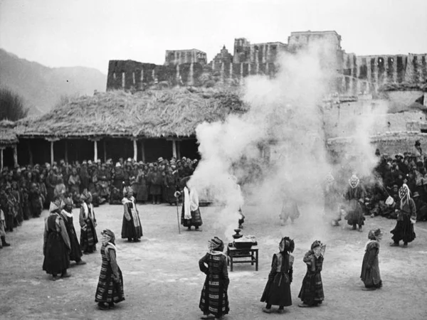 Tibetan opera performers dancing in an outdoor performance Tibetan opera performers dancing in an outdoor performance
