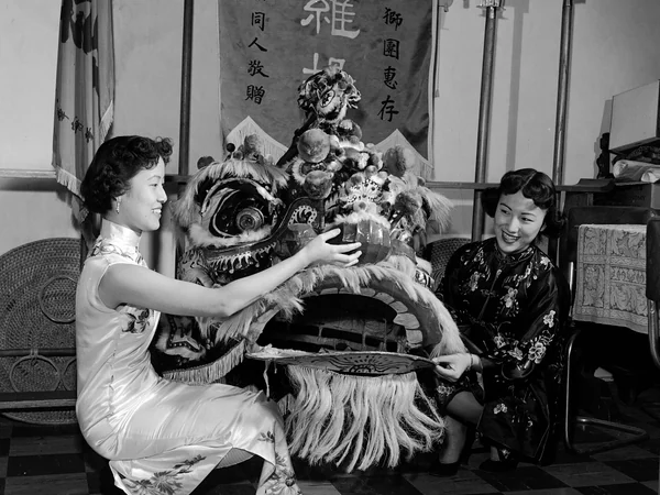 A lion costume being prepared for New Year festivities in 1953