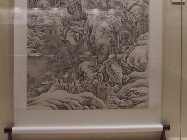 Traditional Chinese landscape painting mounted as a vertical scroll