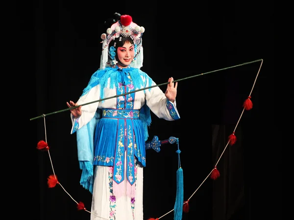 Peking opera performers in contrasting sheng and dan roles