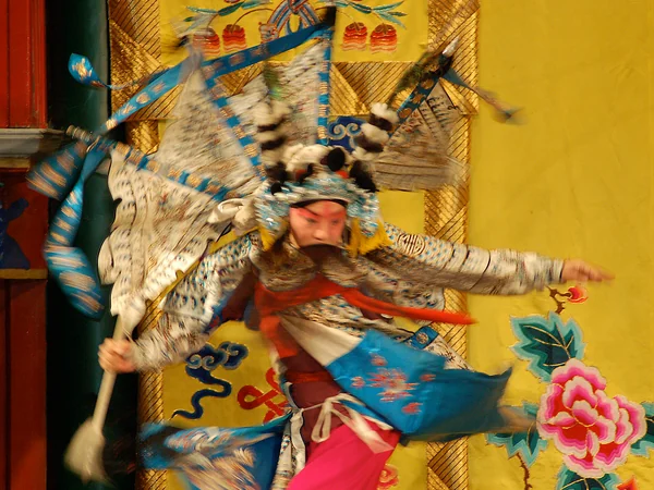 Peking opera performers in elaborate costume and makeup