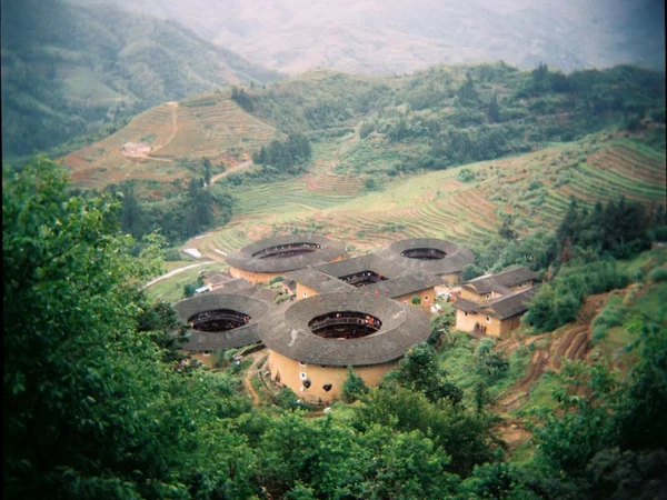 Circular earthen tulou homes in a mountain village in Fujian