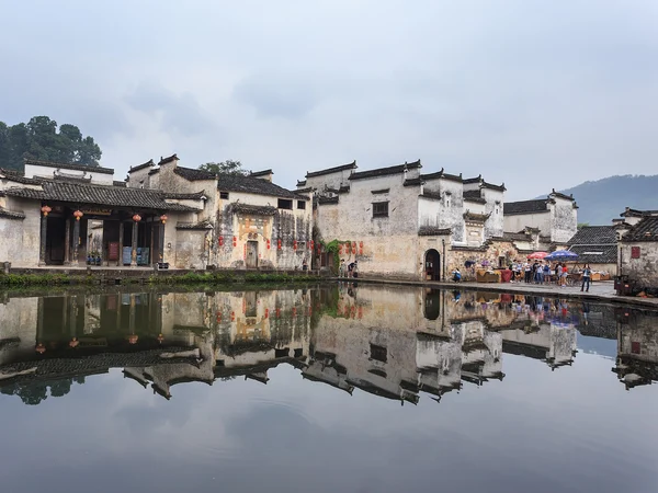 White-walled houses reflected in the water at Hongcun village, Anhui