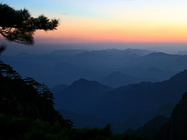 Mountain ridges and a sea of clouds at sunrise in Huangshan