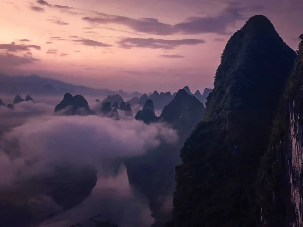 Sunrise over the Li River karst landscape from Xianggong Hill