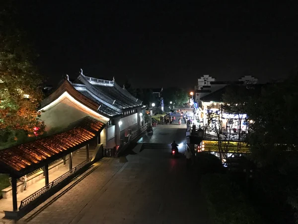 Canal, stone bridge and historic houses in Xitang water town