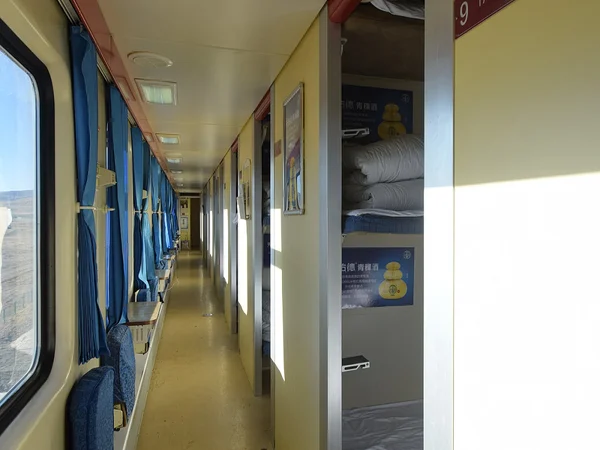 Hard sleeper corridor inside a plateau passenger train