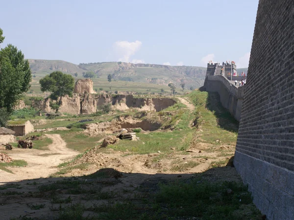 Low rammed-earth remains in the northern landscape associated with Qin frontier defenses Low rammed-earth remains in the northern landscape associated with Qin frontier defenses