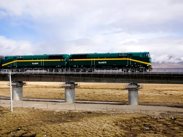 Qinghai Tibet passenger train crossing the high plateau