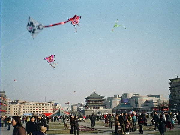 People flying kites during a spring outing in China
