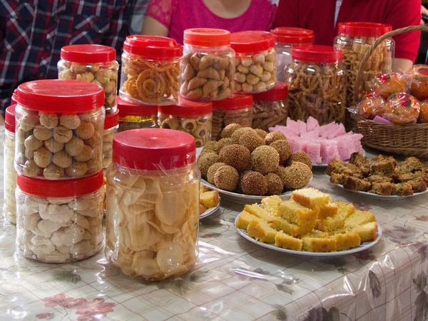 Chinese New Year cookies, cakes and mandarin oranges in Malaysia