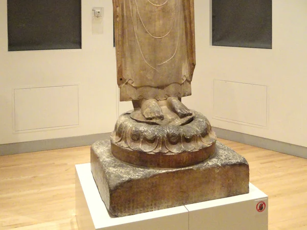 A Buddhist statue inside a historic Chinese temple complex