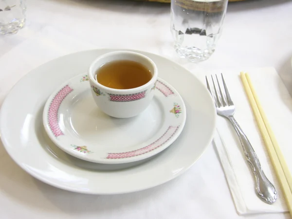 Chinese restaurant place setting with chopsticks bowl spoon and teacup Chinese restaurant place setting with chopsticks bowl spoon and teacup