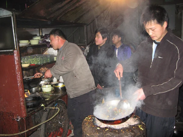 Fresh food being cooked to order at a busy street stall in China Fresh food being cooked to order at a busy street stall in China