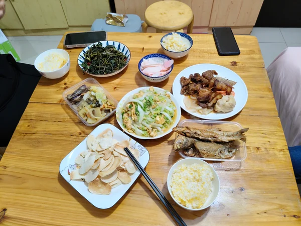 Chinese family-style dinner with cooked dishes in Shanghai