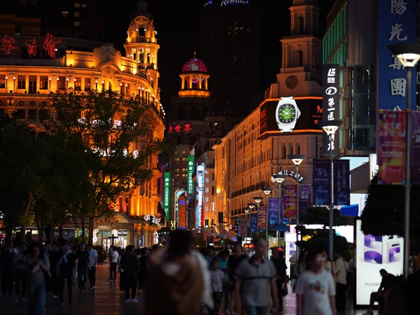 Shoppers on Nanjing Road in Shanghai at night