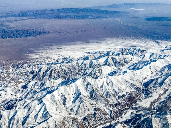 Qilian Mountains rising beyond the Hexi Corridor in Gansu