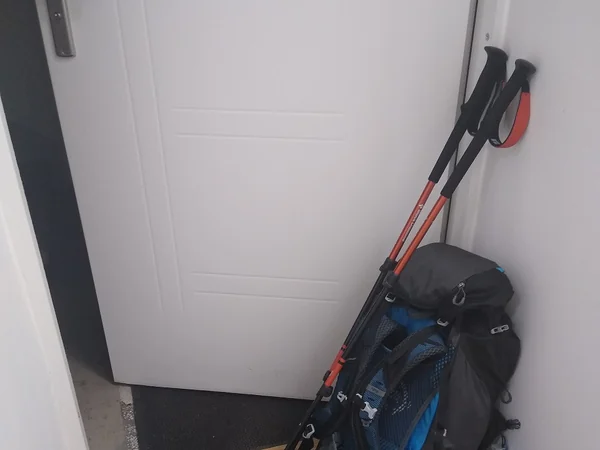 Backpack and trekking poles representing practical gear for a Silk Road journey Backpack and trekking poles representing practical gear for a Silk Road journey