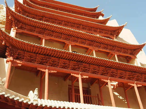 Mogao Caves near Dunhuang in the desert landscape of Gansu Mogao Caves near Dunhuang in the desert landscape of Gansu