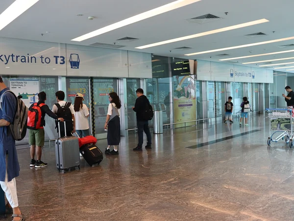 Passenger beginning a Singapore-to-China journey at Changi Airport