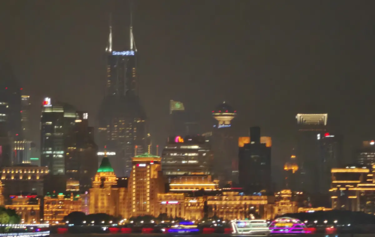 Shanghai Bund illuminated beside the Huangpu River at night