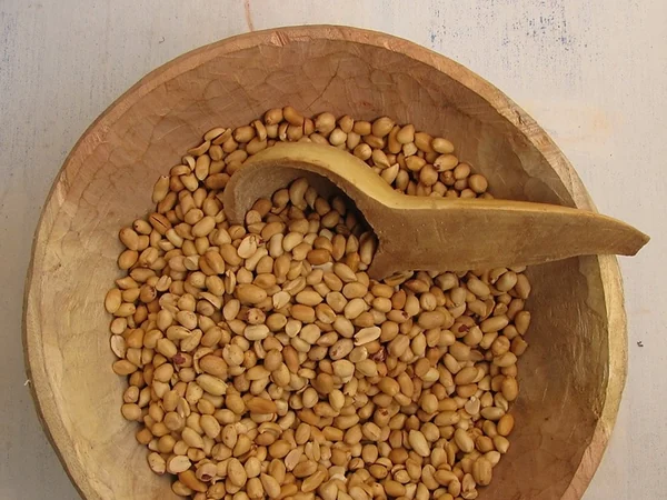 Roasted peanuts arranged in a small serving dish Roasted peanuts arranged in a small serving dish