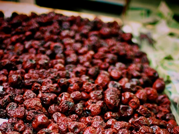 Dried Chinese red dates displayed in a market bowl Dried Chinese red dates displayed in a market bowl