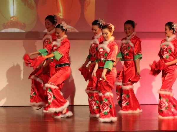 Performers presenting a colorful yangge dance at a public event Performers presenting a colorful yangge dance at a public event
