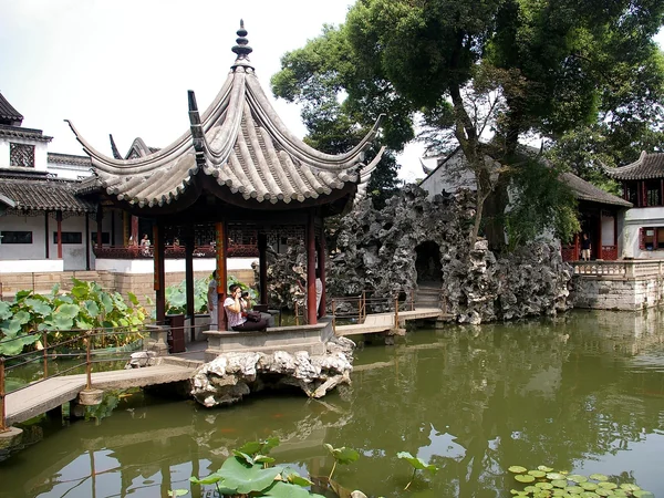 Pavilion, pond and spring greenery in a classical Suzhou garden Pavilion, pond and spring greenery in a classical Suzhou garden