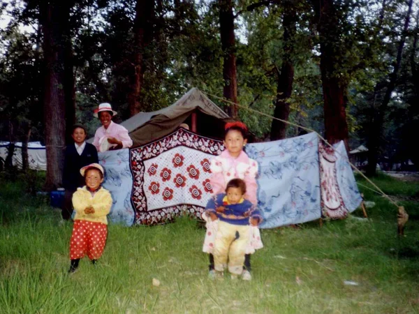 Tibetan family in festival dress at the Shoton celebration