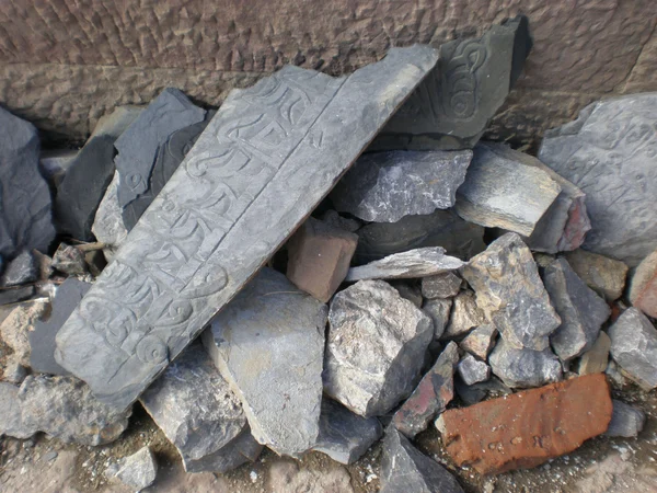 Tibetan script preserved on wall fragments in Shangri-La