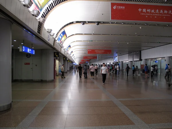 International travelers arriving at an airport in Beijing
